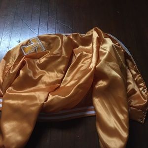 Two Throwback NCAA And NFL Jackets